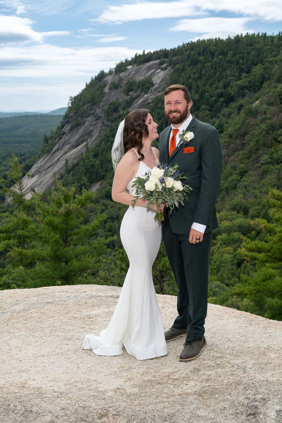 Bride and groom on the cliff top of Cathedral Ledge before their Echo Lake ceremony